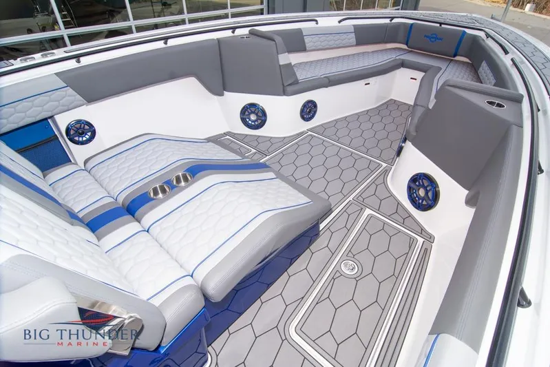  Yacht Photos Pics 2022 Fountain 38 SC boat interior with modern seating and hexagonal flooring design.