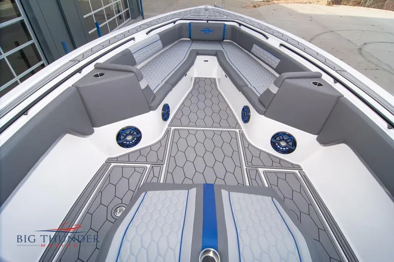  Yacht Photos Pics 2022 Fountain 38 SC boat interior with gray seating and hexagonal flooring design.