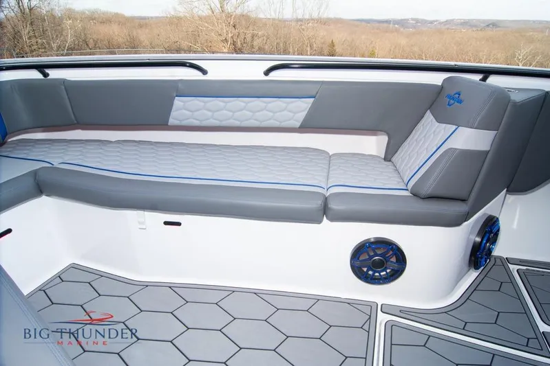  Yacht Photos Pics 2022 Fountain 38 SC boat interior with gray seating and hexagonal flooring.