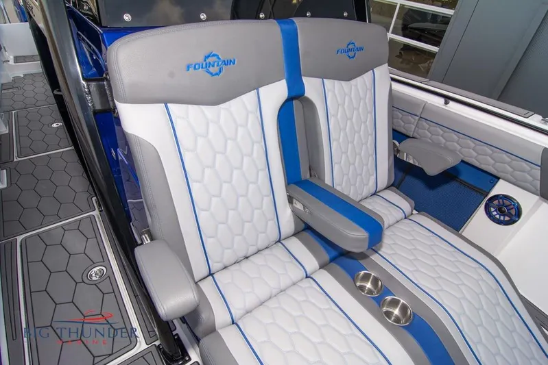  Yacht Photos Pics 2022 Fountain 38 SC boat interior with stylish blue and gray seating.