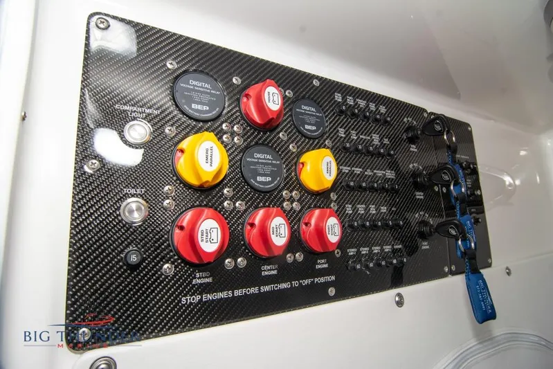  Yacht Photos Pics Control panel of 2022 Fountain 38 SC boat with switches and digital displays.