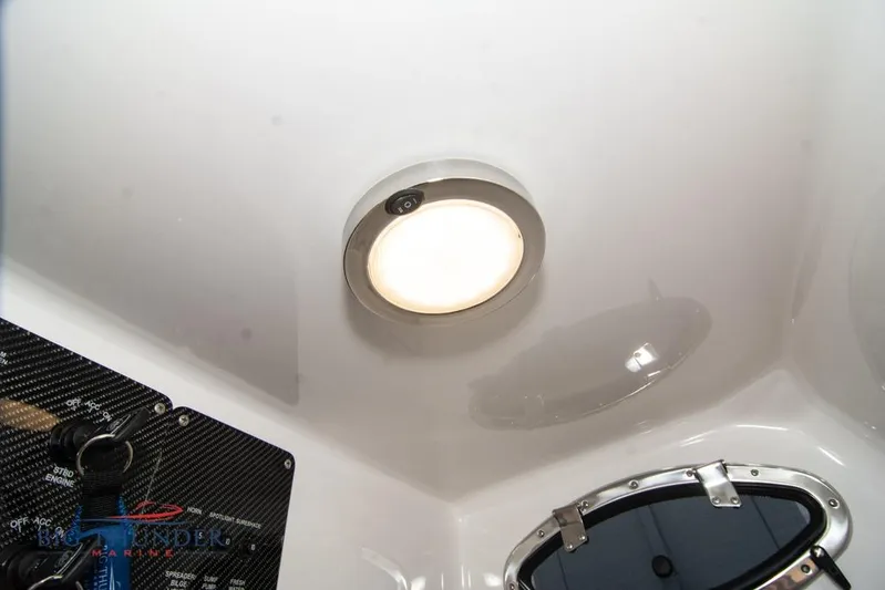  Yacht Photos Pics Interior view of 2022 Fountain 38 SC boat, featuring a ceiling light and control panel.