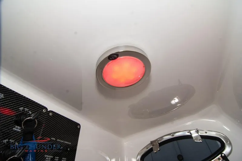  Yacht Photos Pics 2022 Fountain 38 SC interior with red ceiling light and control panel.