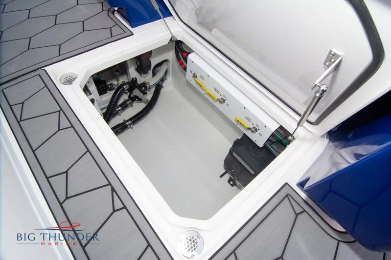  Yacht Photos Pics Open storage compartment of 2022 Fountain 38 SC boat with visible wiring and equipment.