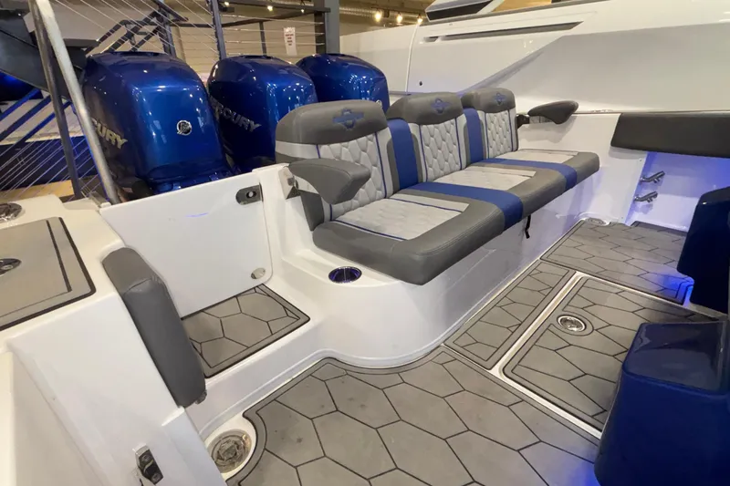  Yacht Photos Pics 2022 Fountain 38 SC boat interior with blue and gray seating and Mercury engines.