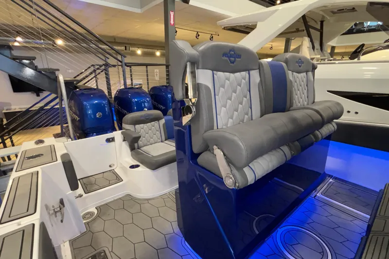  Yacht Photos Pics 2022 Fountain 38 SC boat interior with luxurious seating and blue LED lighting.