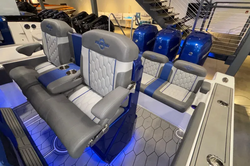  Yacht Photos Pics 2022 Fountain 38 SC boat interior with luxurious seating and multiple outboard engines.