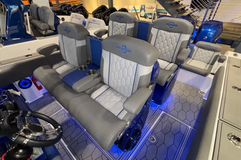  Yacht Photos Pics Luxurious interior of 2022 Fountain 38 SC boat with plush seating and modern design.