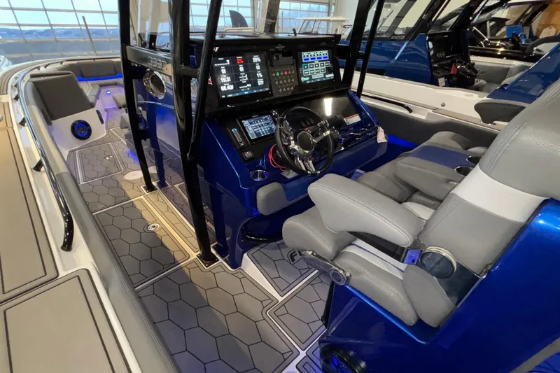  Yacht Photos Pics 2022 Fountain 38 SC boat interior with modern dashboard and seating.