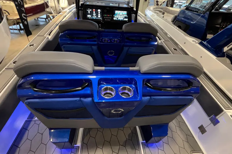  Yacht Photos Pics Interior of 2022 Fountain 38 SC boat with blue seating and modern dashboard.