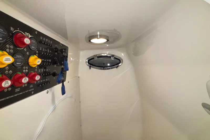  Yacht Photos Pics Control panel and porthole inside 2022 Fountain 38 SC boat cabin.