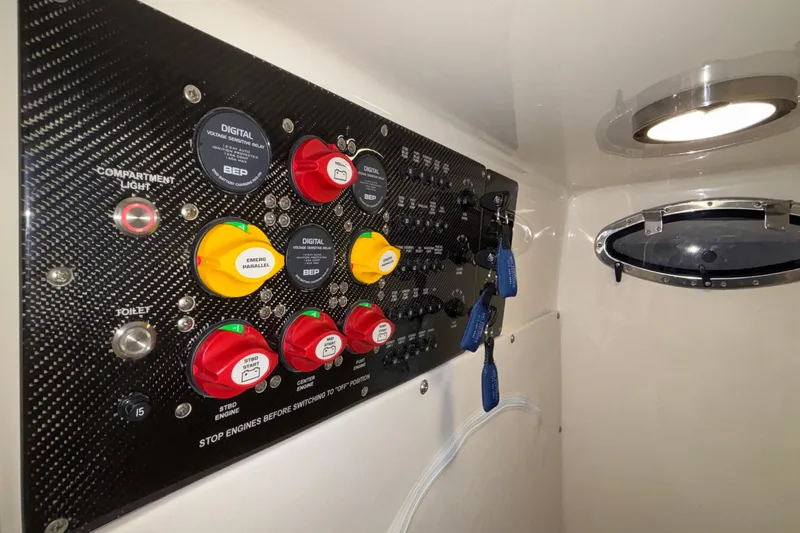  Yacht Photos Pics Control panel of 2022 Fountain 38 SC boat with switches and keys.