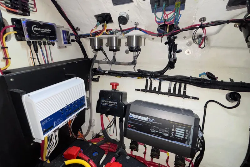  Yacht Photos Pics Electrical system inside a 2022 Fountain 38 SC boat, featuring various components and wiring.
