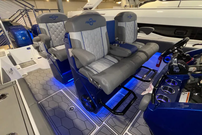  Yacht Photos Pics 2022 Fountain 38 SC boat interior with luxurious seating and blue LED lighting.
