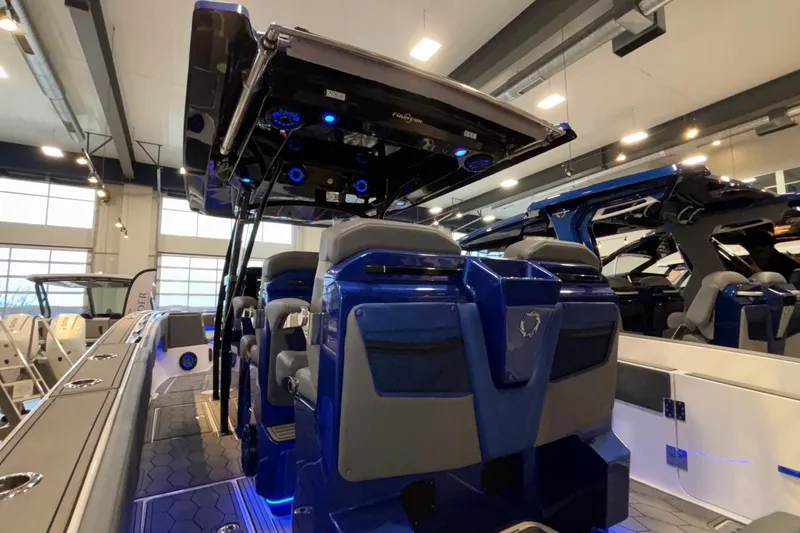  Yacht Photos Pics 2022 Fountain 38 SC boat interior with blue LED lighting in showroom.