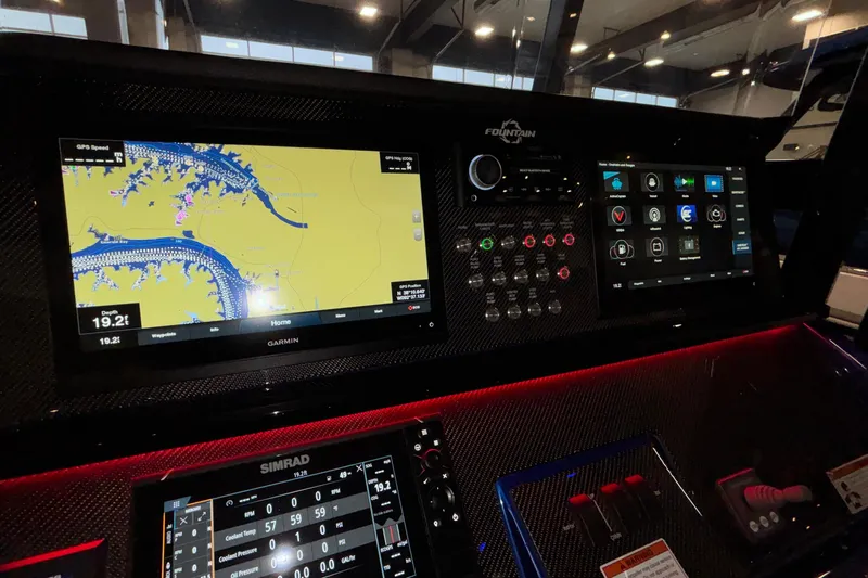  Yacht Photos Pics Dashboard of 2022 Fountain 38 SC boat with navigation and control screens.