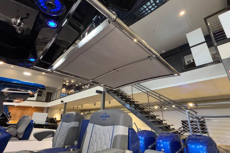  Yacht Photos Pics 2022 Fountain 38 SC boat interior with blue seating and modern design elements.
