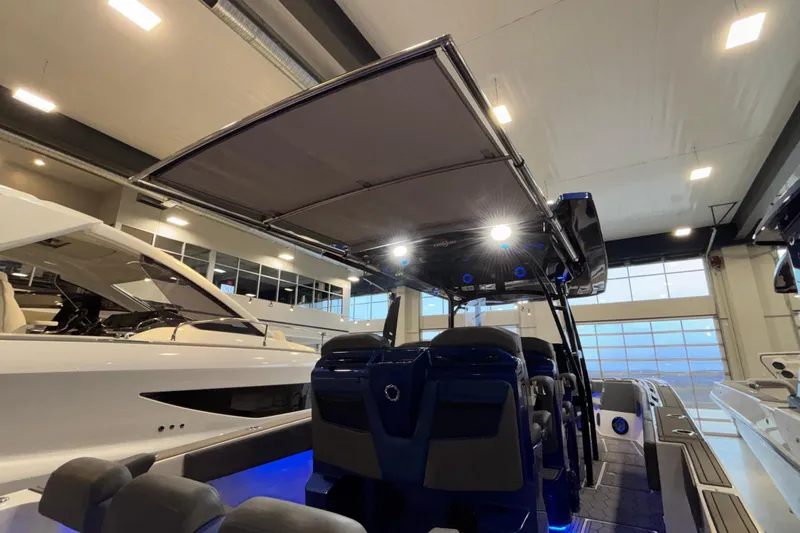  Yacht Photos Pics 2022 Fountain 38 SC boat interior with illuminated seating and canopy in showroom.