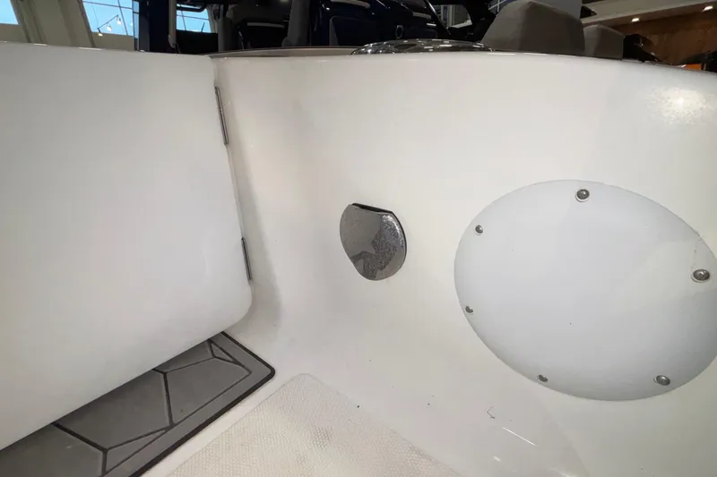  Yacht Photos Pics 2022 Fountain 38 SC boat interior detail with white panel and metal fixture.