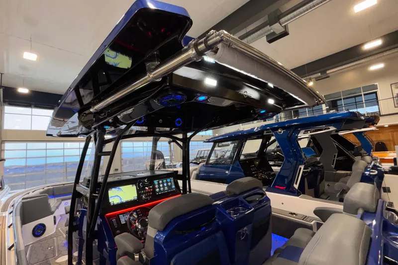  Yacht Photos Pics 2022 Fountain 38 SC boat interior with advanced navigation system and luxurious seating.