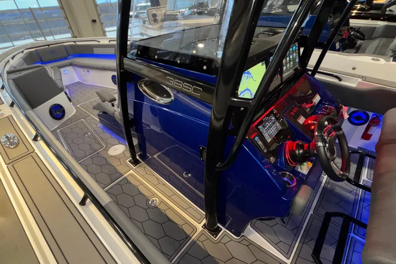  Yacht Photos Pics 2022 Fountain 38 SC boat interior with modern dashboard and blue LED lighting.