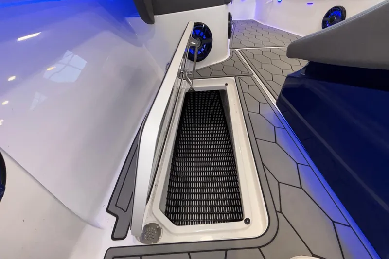  Yacht Photos Pics 2022 Fountain 38 SC boat interior with open storage compartment and modern flooring design.