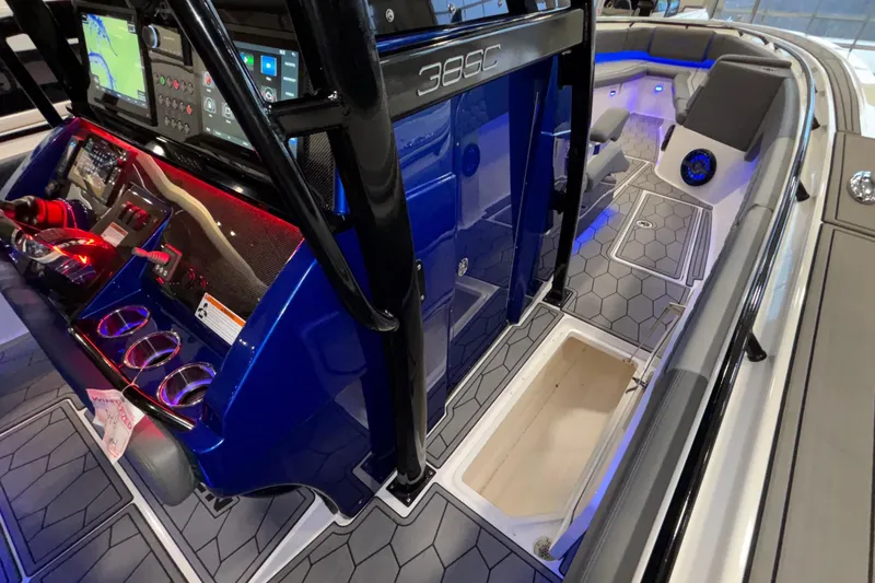  Yacht Photos Pics 2022 Fountain 38 SC boat interior with modern dashboard and seating, featuring blue and gray accents.