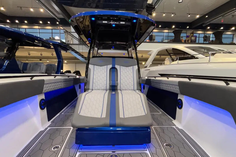  Yacht Photos Pics 2022 Fountain 38 SC boat interior with modern seating and ambient blue lighting.
