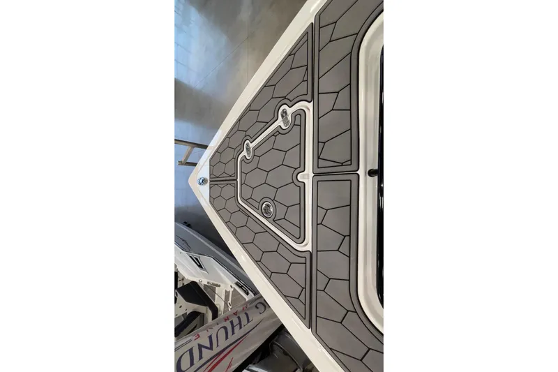  Yacht Photos Pics 2022 Fountain 38 SC boat deck with geometric pattern and sleek design.