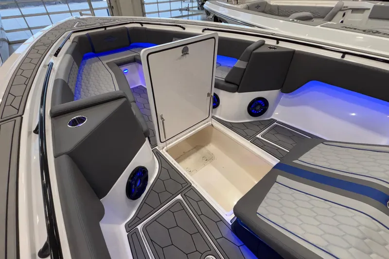  Yacht Photos Pics 2022 Fountain 38 SC boat interior with blue LED lighting and sleek seating design.