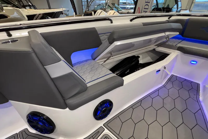  Yacht Photos Pics 2022 Fountain 38 SC boat interior with gray seating and blue LED lighting.