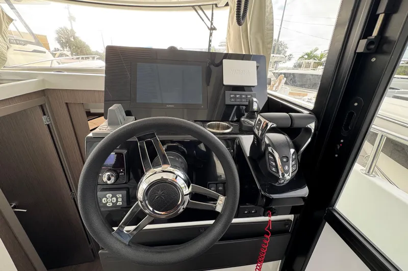  Yacht Photos Pics 2026 Jeanneau NC 895 Sport Series 2 helm with modern controls and navigation system.