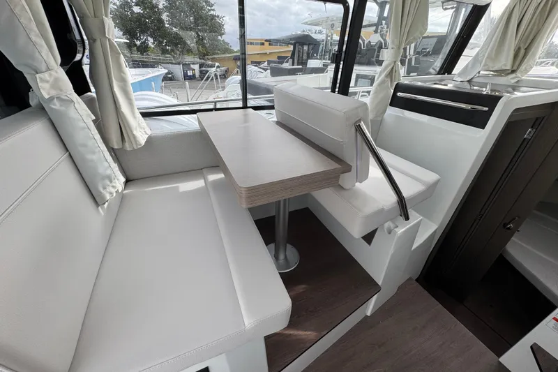  Yacht Photos Pics Interior of 2026 Jeanneau NC 895 Sport Series 2, featuring a cozy dining area.