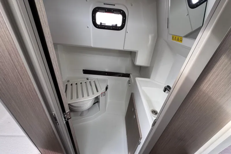  Yacht Photos Pics 2026 Jeanneau NC 895 Sport Series 2 boat bathroom interior with sink and toilet.