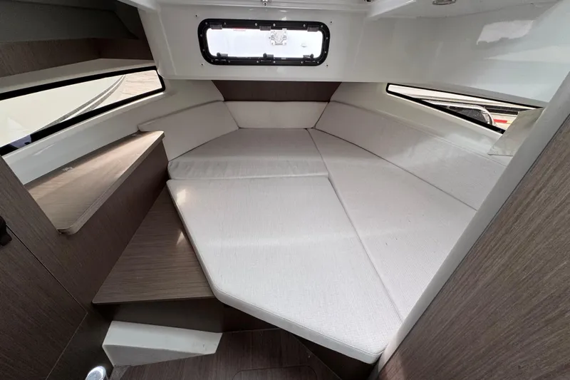  Yacht Photos Pics 2026 Jeanneau NC 895 Sport Series 2 cabin interior with cozy seating and modern design.