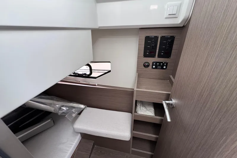  Yacht Photos Pics Interior of 2026 Jeanneau NC 895 Sport Series 2, featuring control panels and seating.