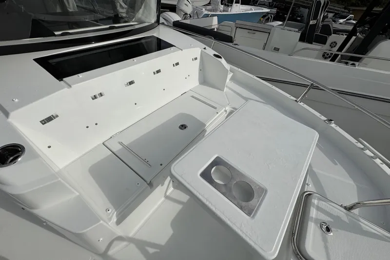  Yacht Photos Pics 2026 Jeanneau NC 895 Sport Series 2 boat deck with seating and table.