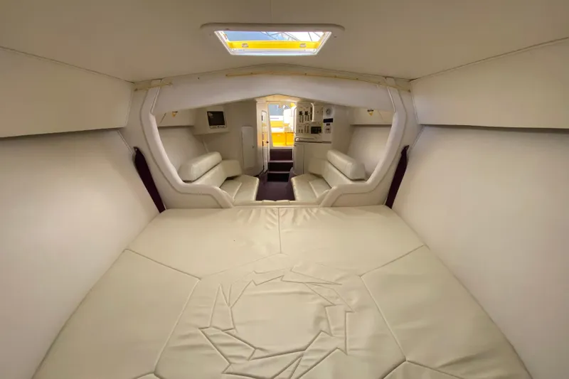  Yacht Photos Pics Interior of 1999 Fountain 47 Lightning boat with white leather seating and modern design.