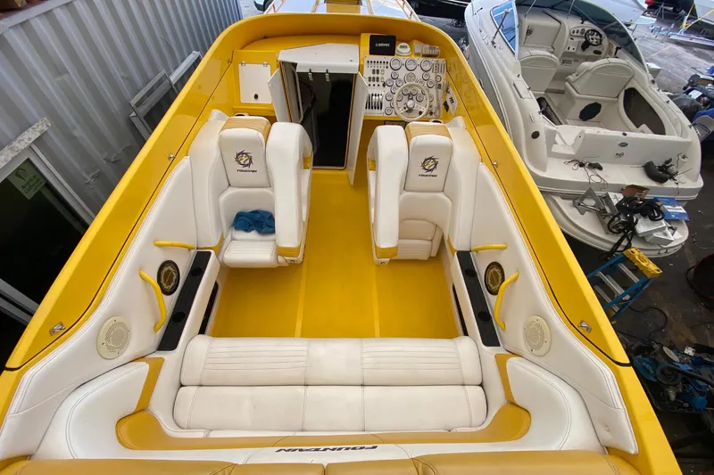  Yacht Photos Pics Interior of a 1999 Fountain 47 Lightning boat, yellow and white design.