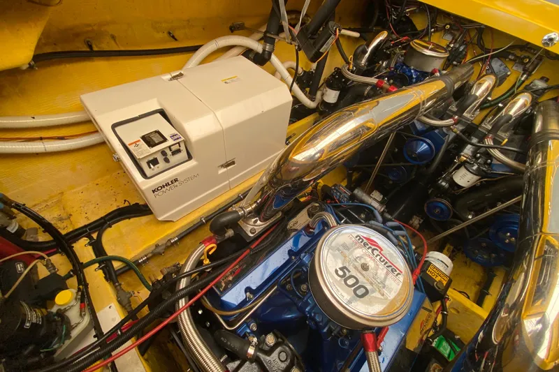  Yacht Photos Pics Engine room of 1999 Fountain 47 Lightning with Kohler power system and MerCruiser engine.