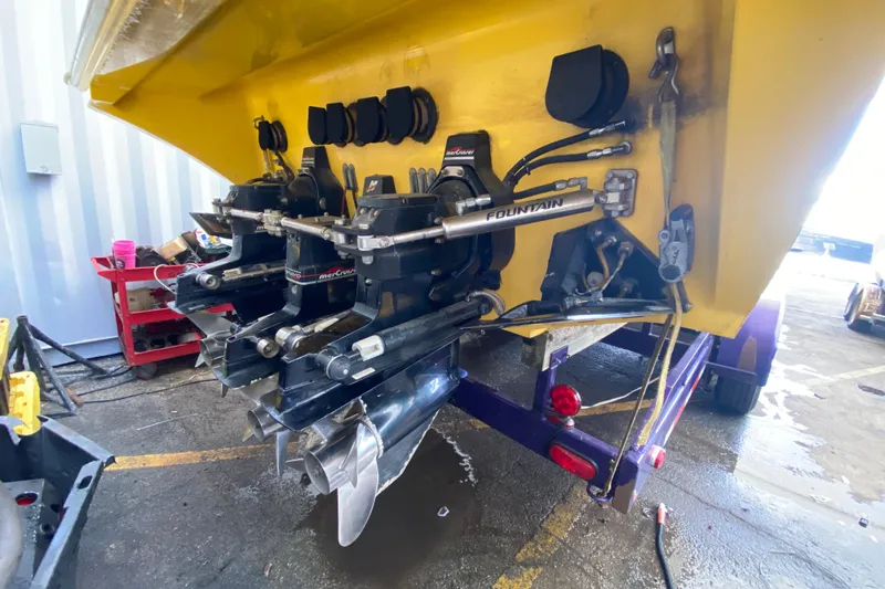 Yacht Photos Pics Rear view of a 1999 Fountain 47 Lightning boat with dual MerCruiser engines.