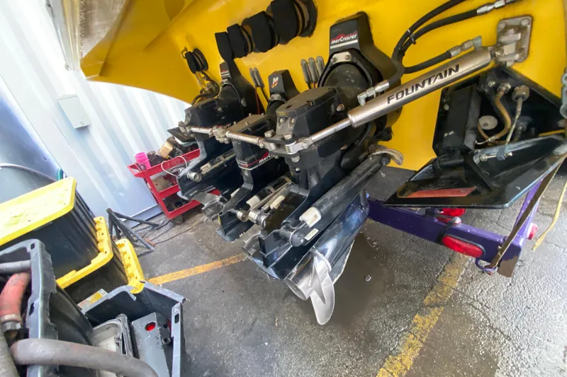  Yacht Photos Pics 1999 Fountain 47 Lightning boat engine components in a workshop setting.