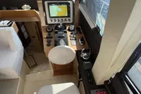 Interior helm of 2017 Azimut Magellano 53 yacht with navigation controls and seating.