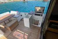 2017 Azimut Magellano 53 yacht deck with seating, table, and open sea view.