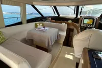Luxurious interior of 2017 Azimut Magellano 53 yacht with elegant seating and navigation equipment.