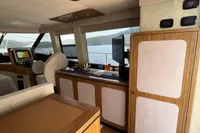 Interior of 2017 Azimut Magellano 53 yacht with modern wood paneling and navigation equipment.
