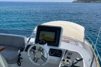 2017 Azimut Magellano 53 yacht helm with ocean view, featuring modern navigation equipment.