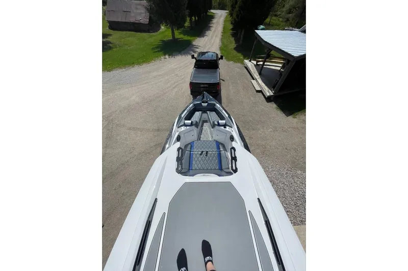  Yacht Photos Pics 2019 Sunsation 32 CCX boat on trailer, viewed from above, with truck towing.