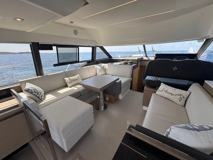  Yacht Photos Pics Luxurious interior of 2023 Prestige 460 yacht with elegant seating and ocean view.