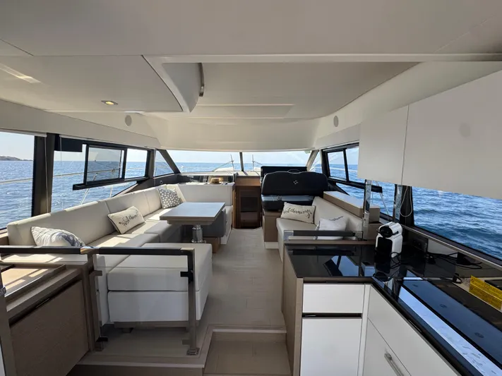  Yacht Photos Pics Luxurious interior of 2023 Prestige 460 yacht with modern seating and ocean view.